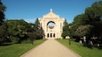 Saint Boniface Cathedral contrasted against a bright blue sky on a sunny day in Winnipeg, Manitoba, Canada. This building serves as the principal church for Eastern Manitoba.