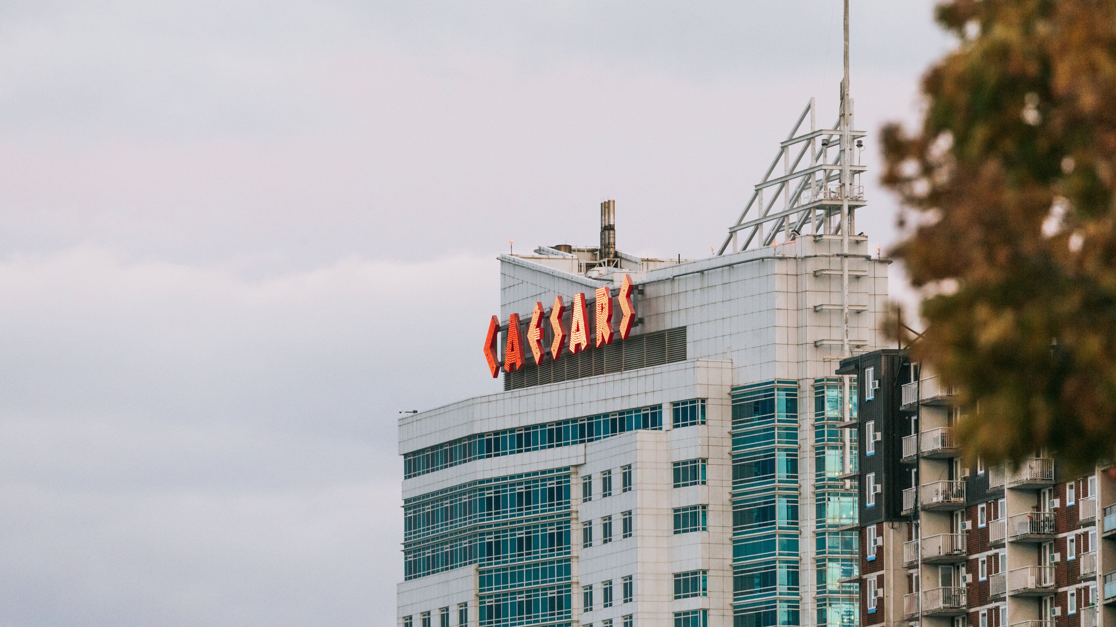Caesars Windsor featuring a skyscraper and signage