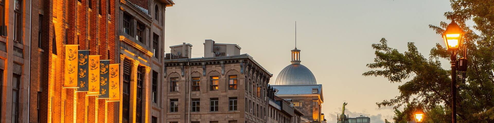 Old Port of Montreal showing a sunset and a city