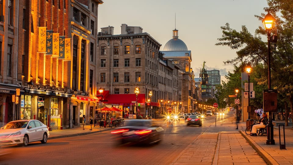 Old Port of Montreal showing a sunset and a city