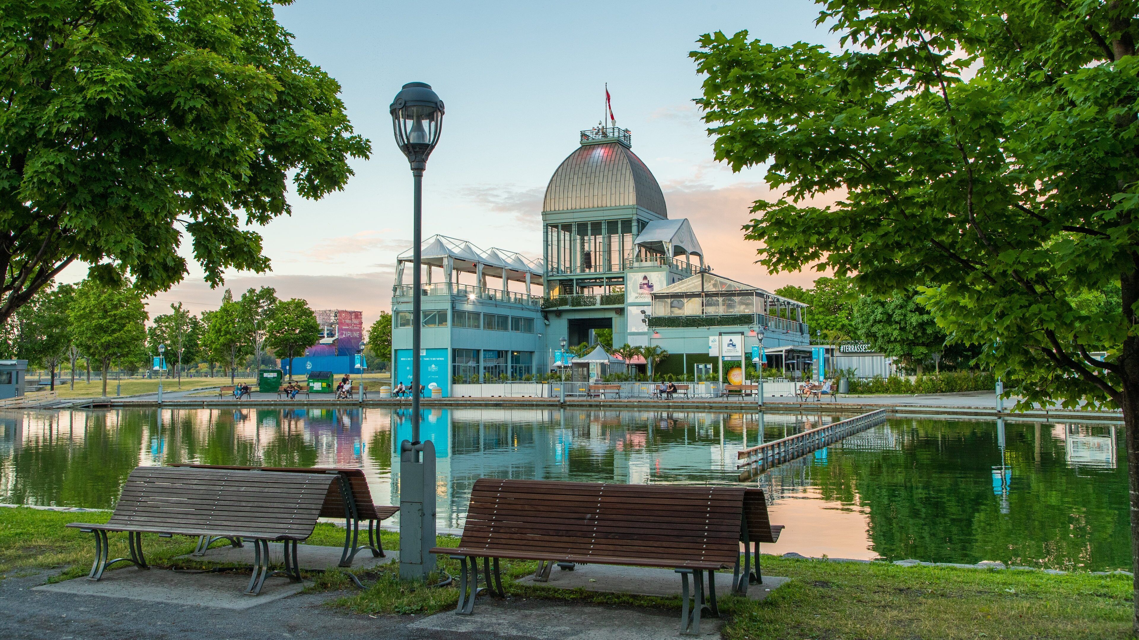 Old Port of Montreal which includes a garden, a pond and a sunset