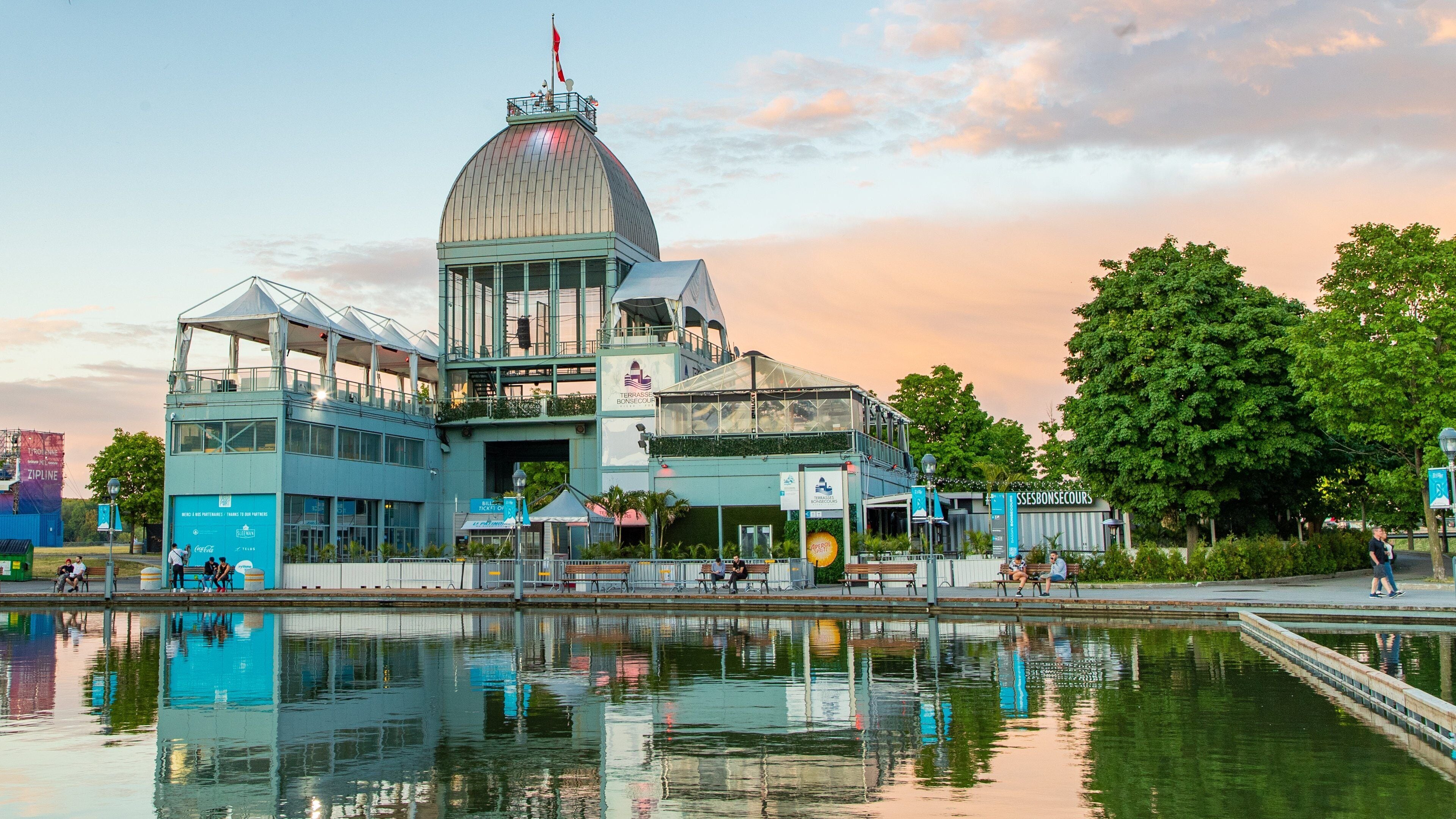 Old Port of Montreal showing a sunset and a lake or waterhole