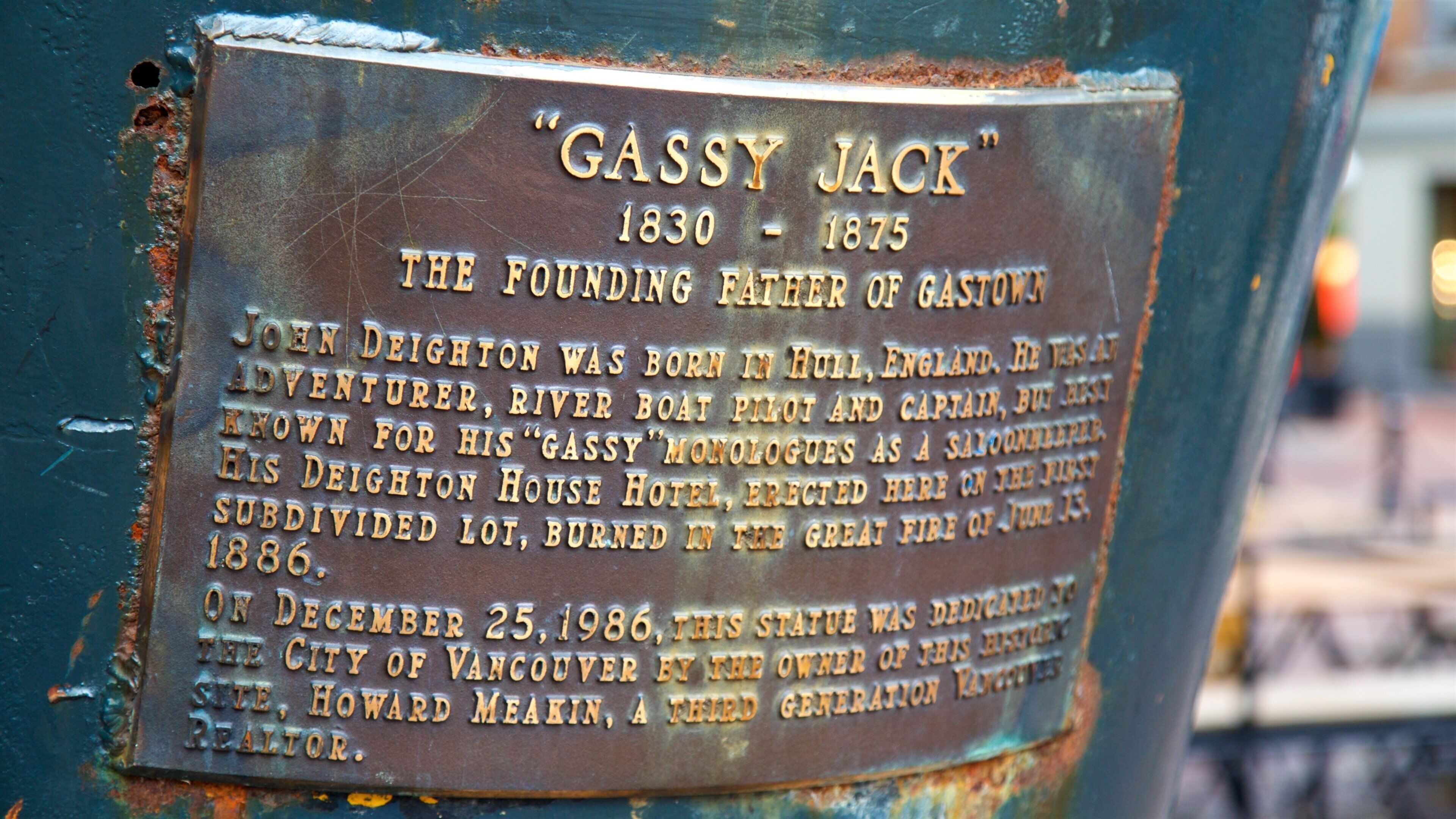 Gassy Jack Statue showing signage and a statue or sculpture