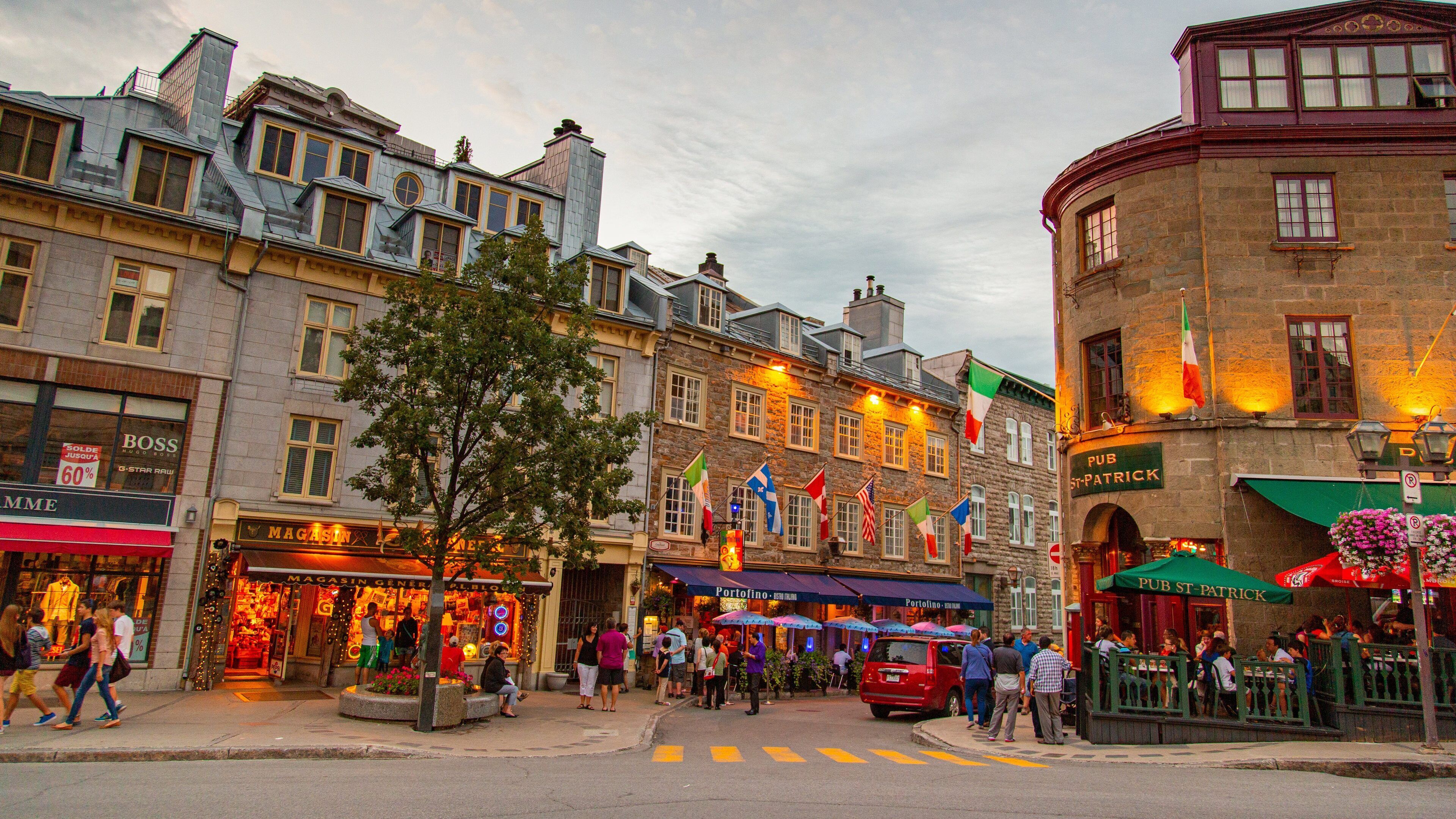 Rue St-Paul featuring a city, a sunset and street scenes