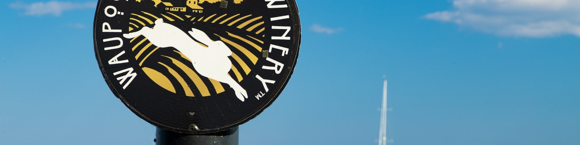 Waupoos Winery featuring general coastal views and signage