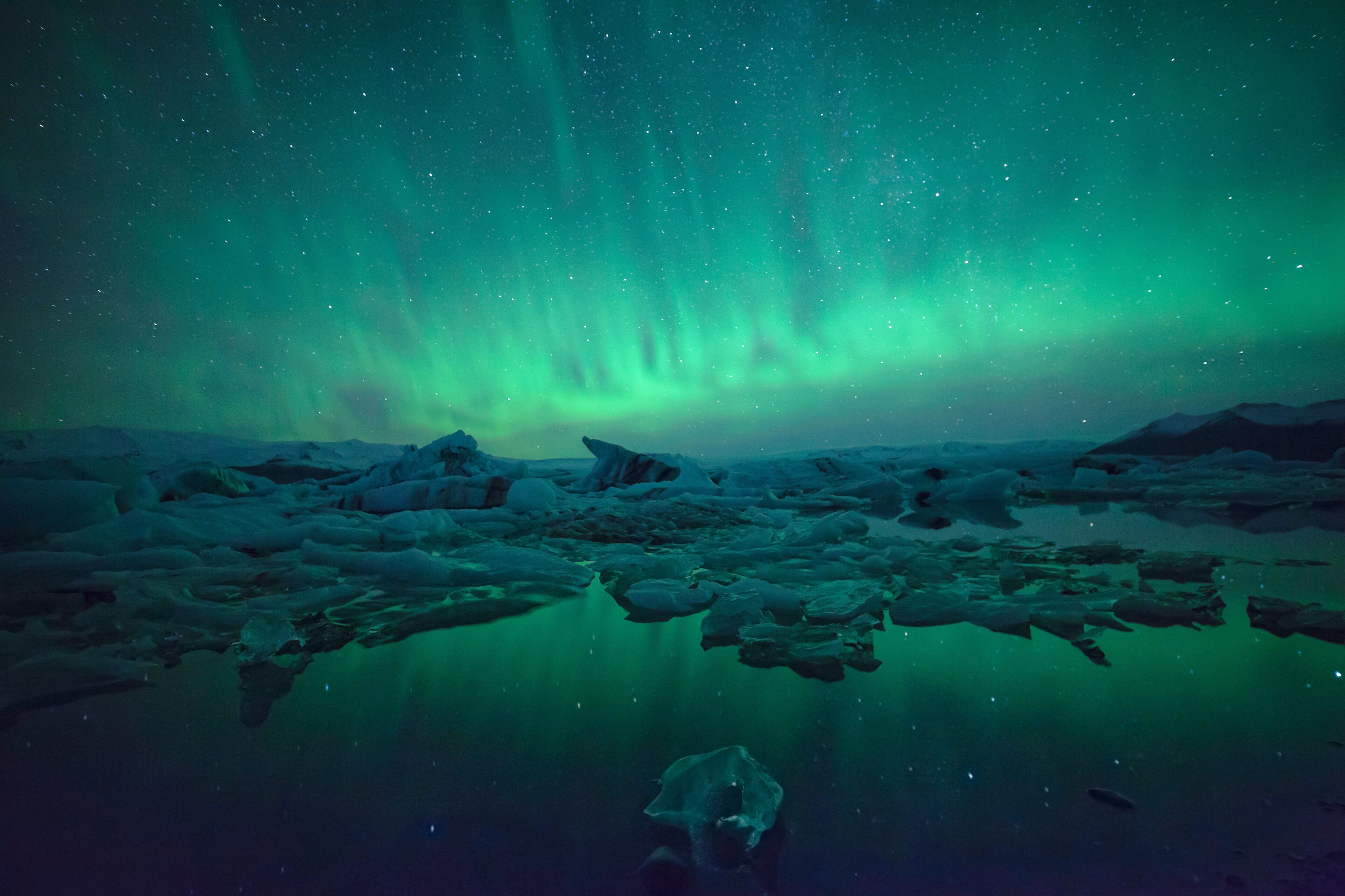 Northern Lights over glacier lagoon in Iceland. Up north northern lights show.