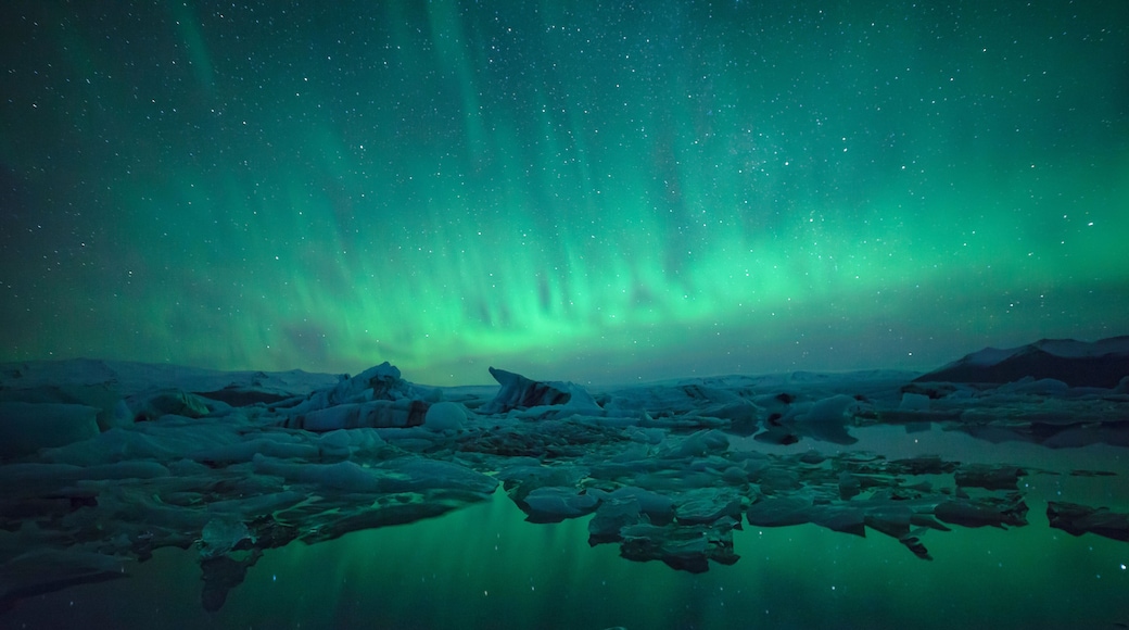 Northern Lights over glacier lagoon in Iceland. Up north northern lights show.