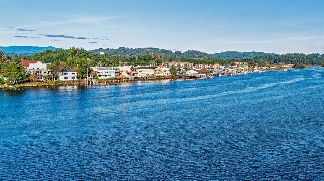 Panorama of the Siuslaw River flowing by the historic Old Town section of Florence, Oregon, USA