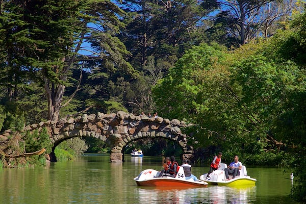 Stow Lake which includes boating, a river or creek and a bridge