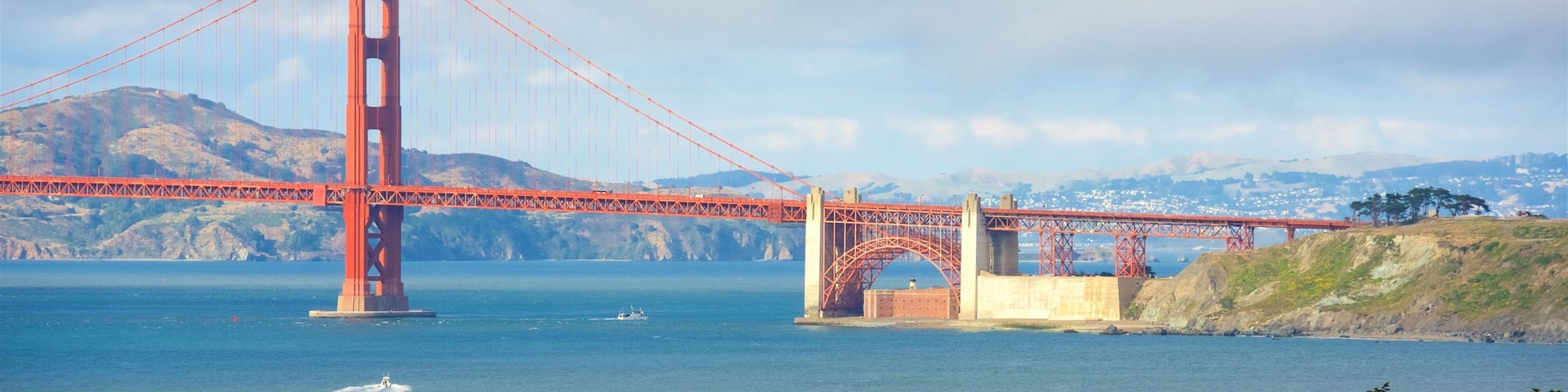 Coastal Trail featuring a bridge and a river or creek