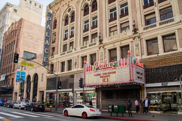 Palace Theater which includes a city, street scenes and signage