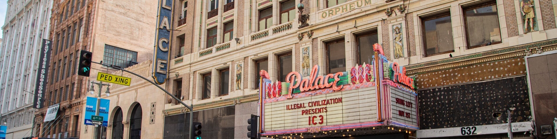 Palace Theater which includes a city, street scenes and signage