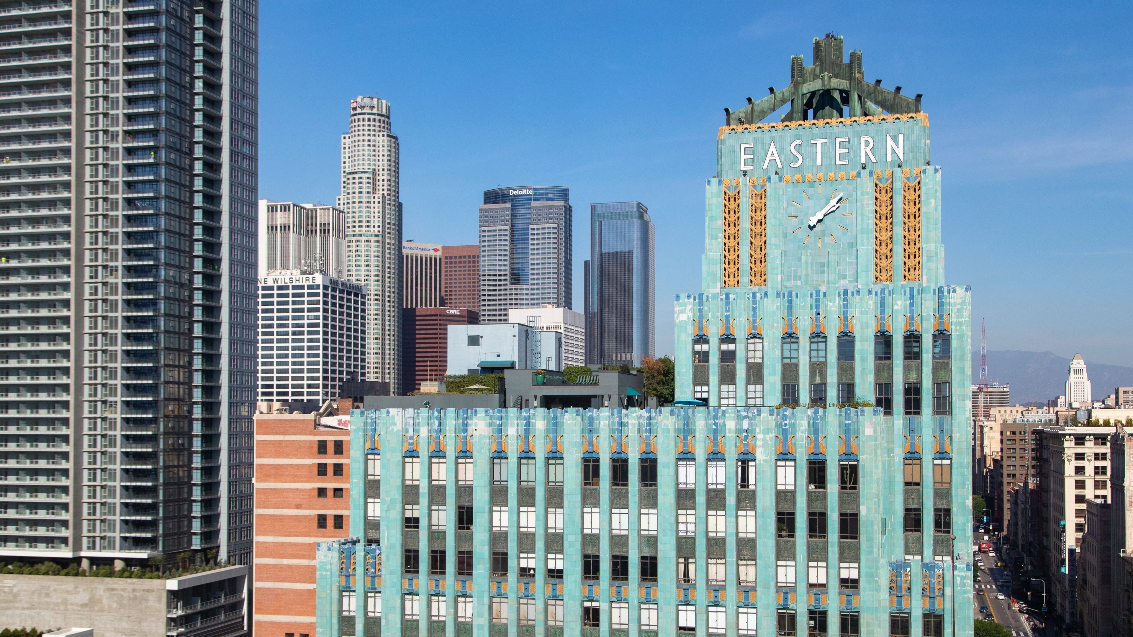 Eastern Columbia Building showing a high rise building, a city and signage