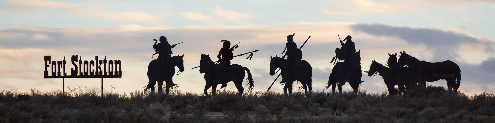 Fort Stockton Indians statues at sunset