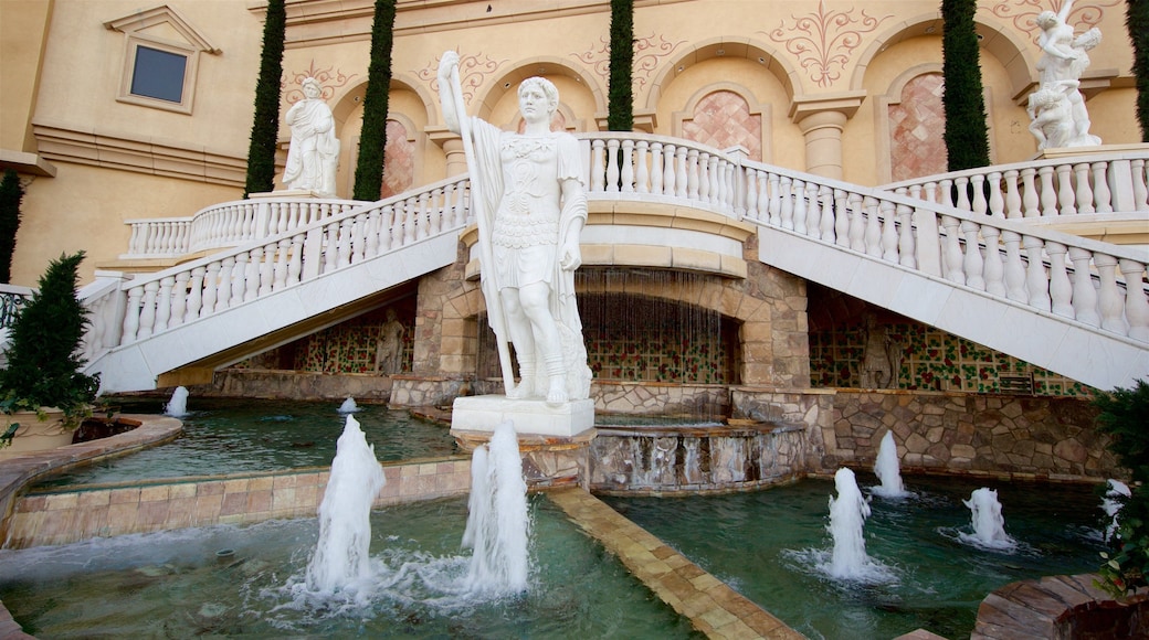 Reno montrant casino, fontaine et statue ou sculpture