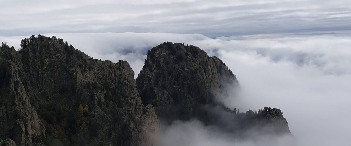 Rare "cloud sandwich" between two separate layers of clouds, said to happen every 5 years or so.