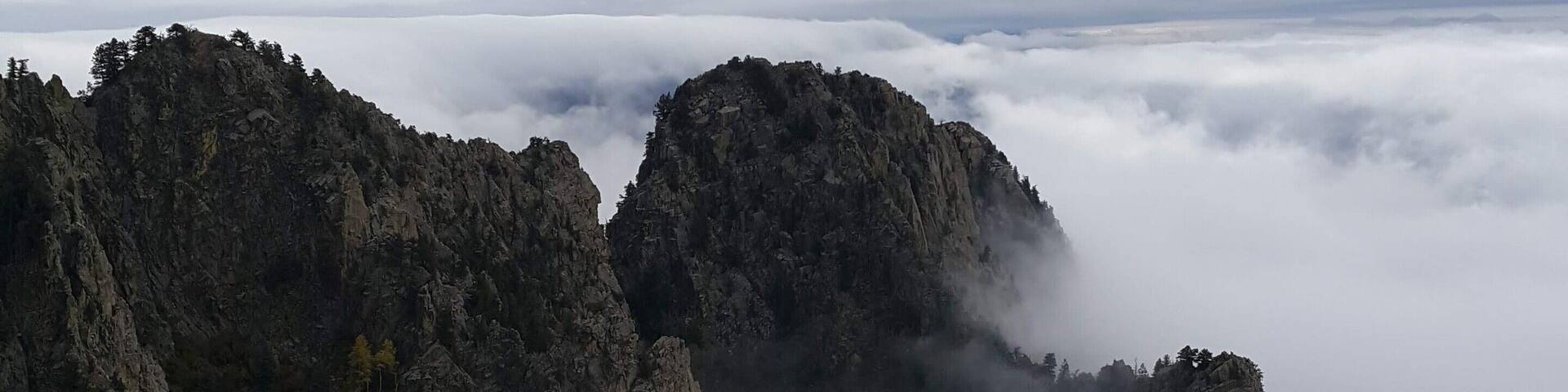 Rare "cloud sandwich" between two separate layers of clouds, said to happen every 5 years or so.