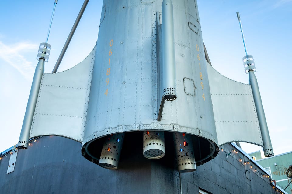 A space shuttle with visible structural details and numbers on its body.