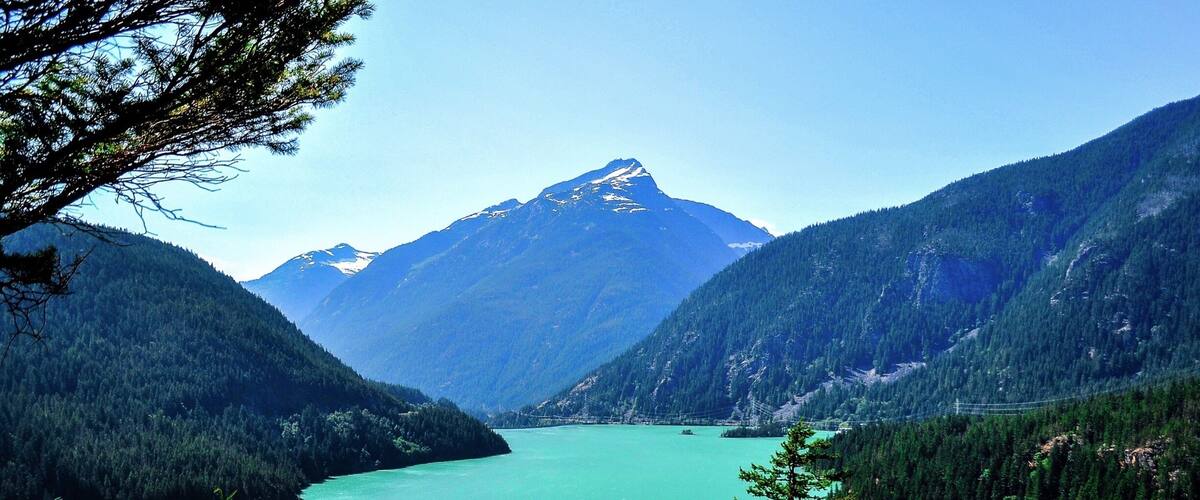 Diablo Lake is a reservoir in the North Cascade mountains of northern Washington state, United States. Created by Diablo Dam, the lake is located between Ross Lake and Gorge Lake on the Skagit River at an elevation of 1,201 feet (366 m) above sea level.
The unique, intense turquoise hue of the lake's water is attributed to the surrounding glaciers that grind rocks into a fine powder that is carried into the lake through creeks. That fine powder stays suspended in the lake, giving the water its brilliant color. #nationalpark #roadtrip
