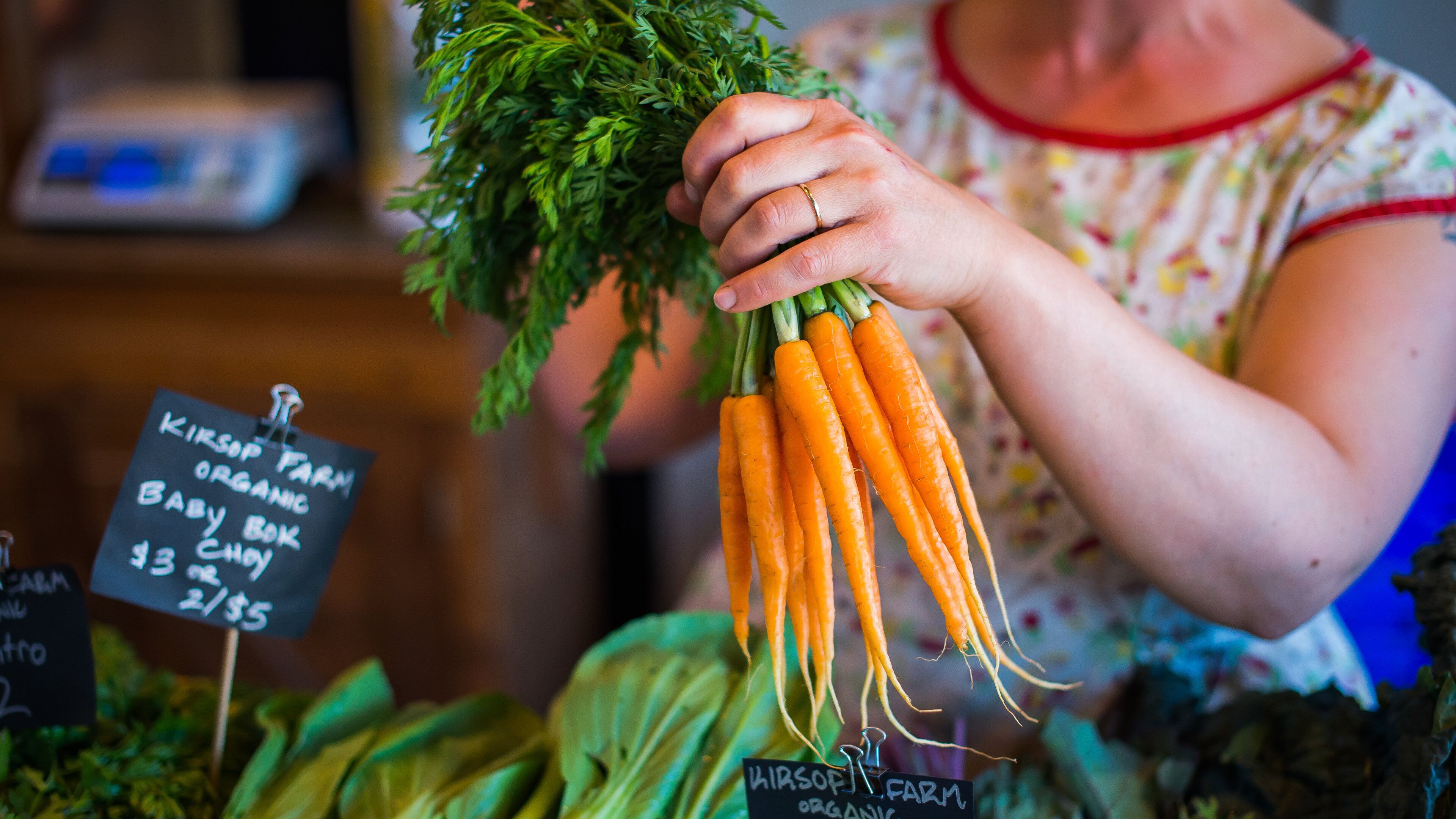 Olympia Farmers Market which includes markets and food as well as an individual femail
