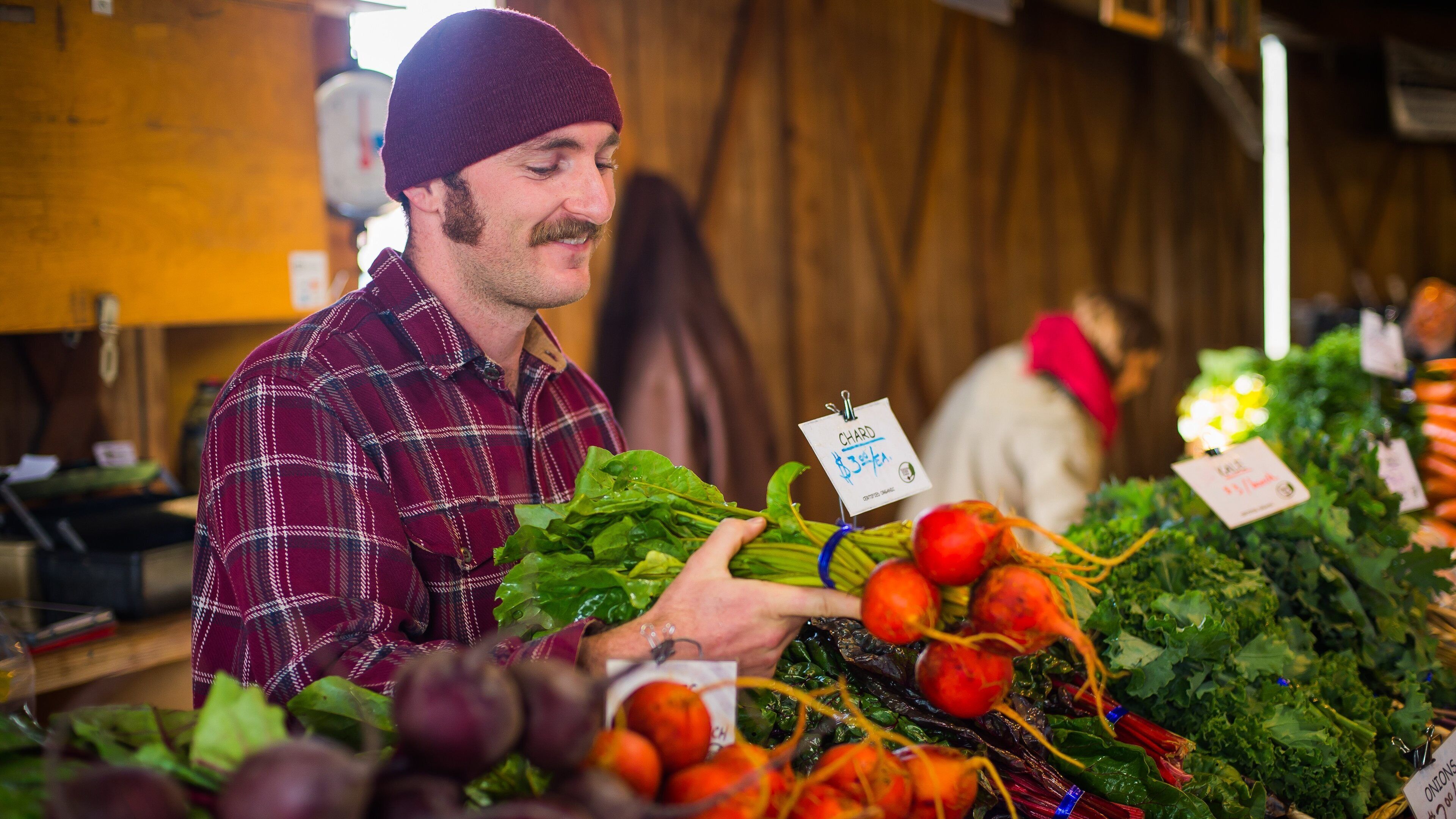 Olympia Farmers Market featuring food and markets as well as an individual male