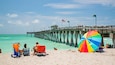 Venice Fishing Pier which includes a sandy beach and general coastal views as well as a couple