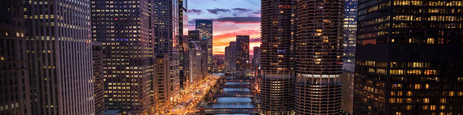 Downtown city buildings and skyline over the Chicago River Illinois USA