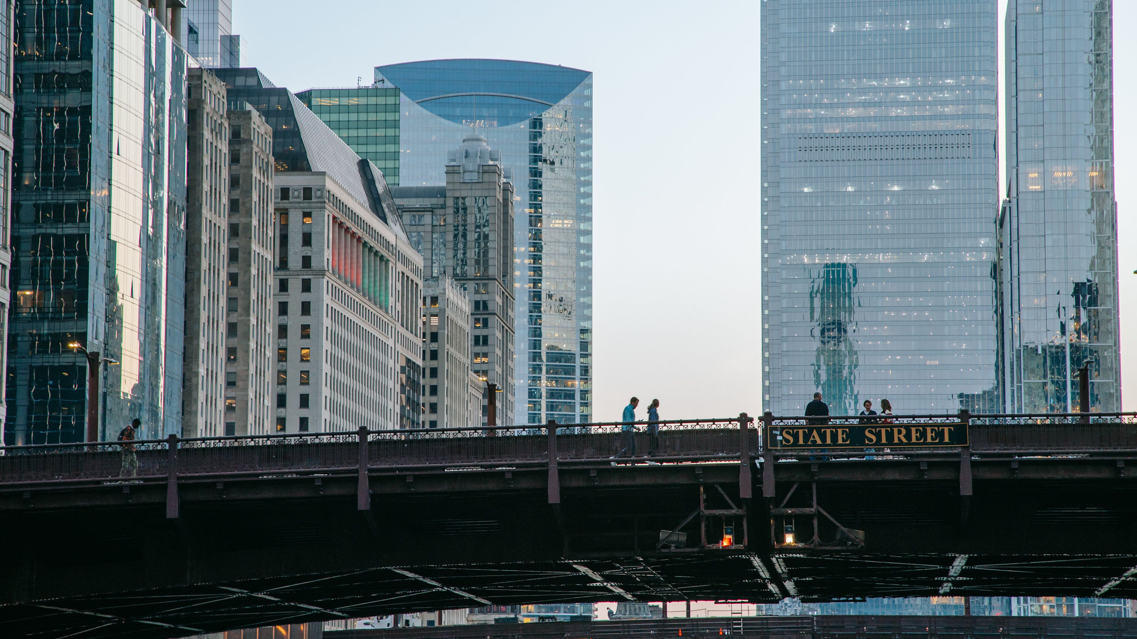 Chicago Riverwalk featuring a bridge and a city
