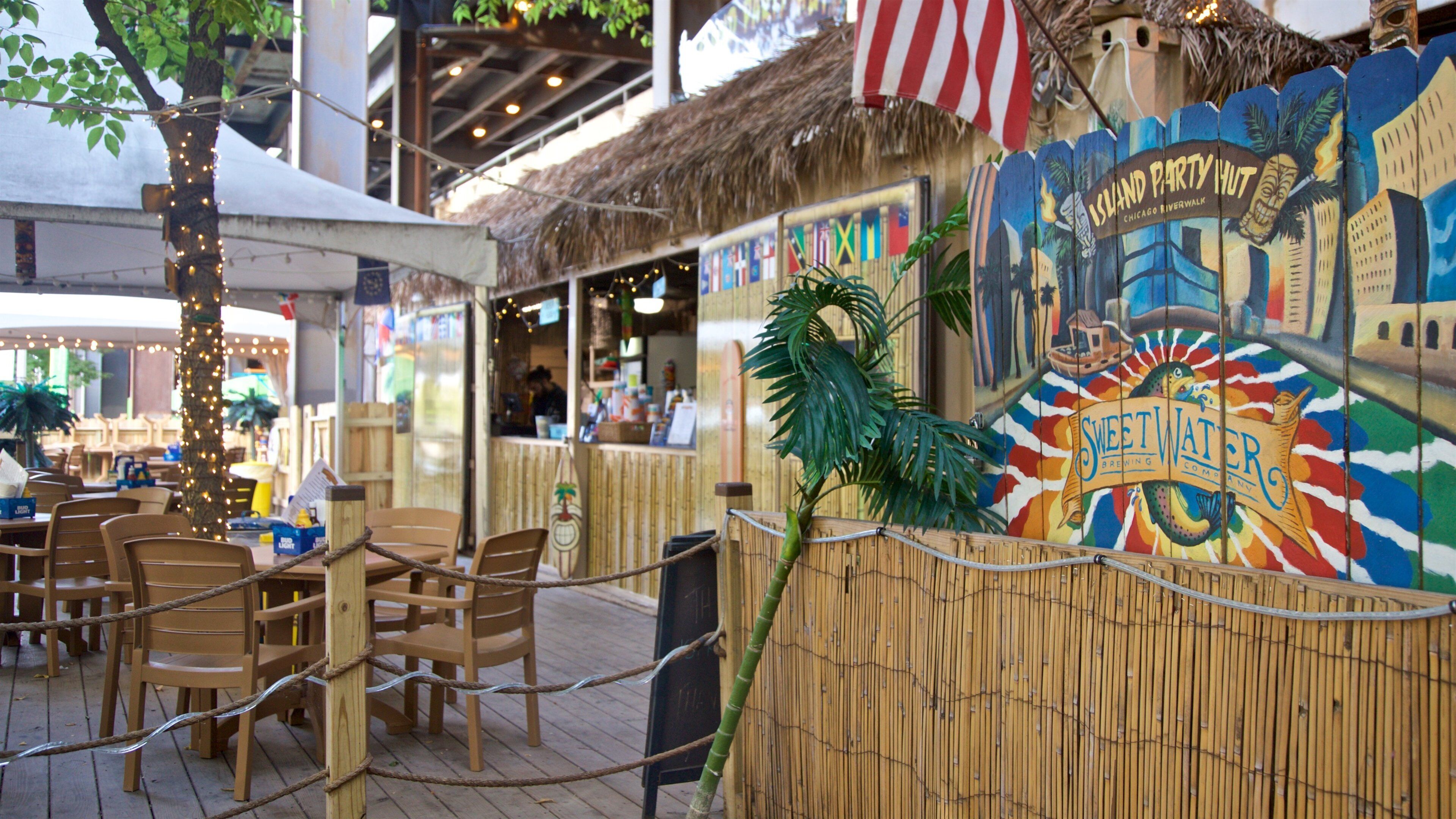 Chicago Riverwalk showing outdoor art and a beach bar