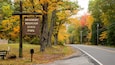 A road with a sign for Bradbury Mountain State Park.