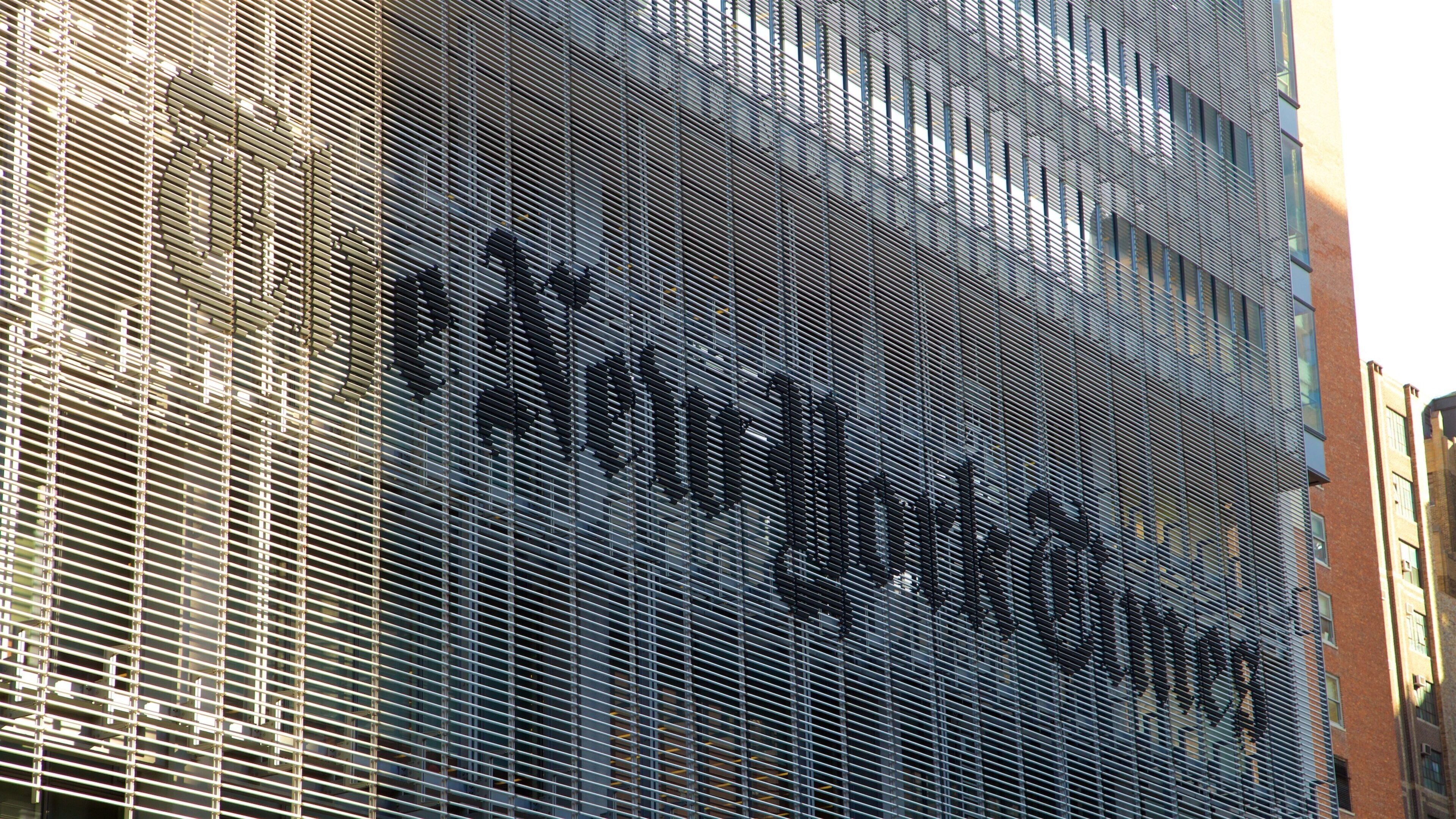 New York Times Building featuring signage and a city