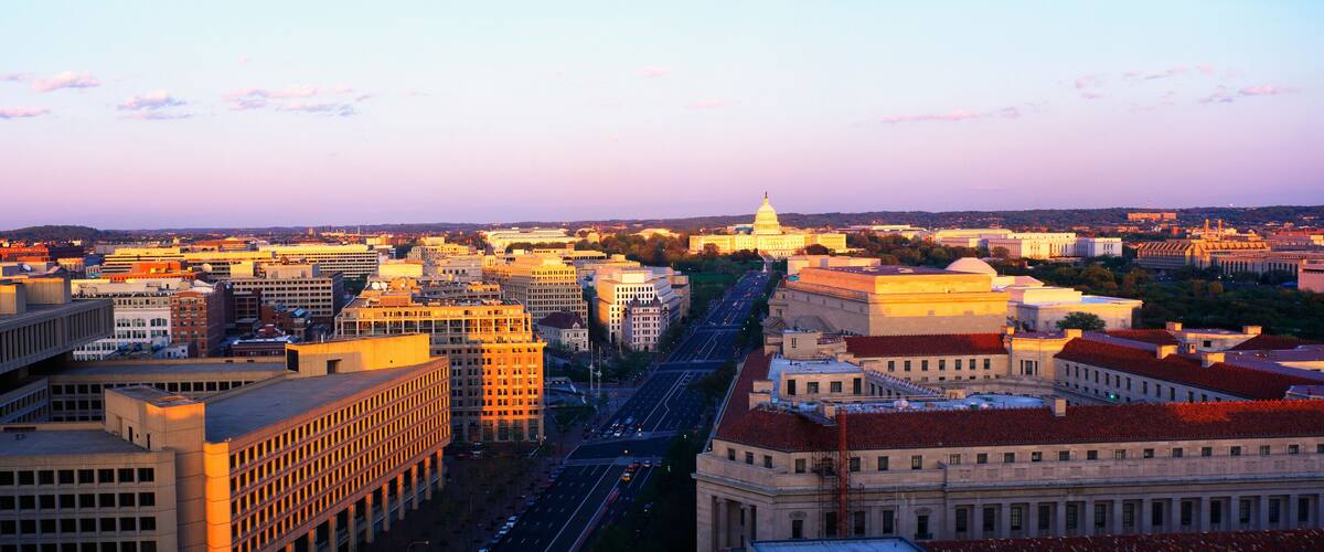 This is an aerial view of Washington, DC showing Pennsylvania Avenue to the U.S. Capitol at sunset. The view is from the Old Post Office.