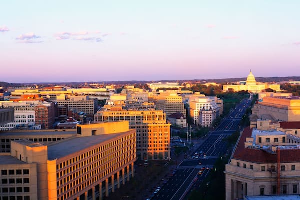 This is an aerial view of Washington, DC showing Pennsylvania Avenue to the U.S. Capitol at sunset. The view is from the Old Post Office.