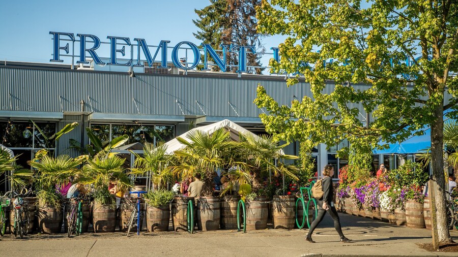 Fremont Brewing featuring signage and street scenes as well as an individual femail