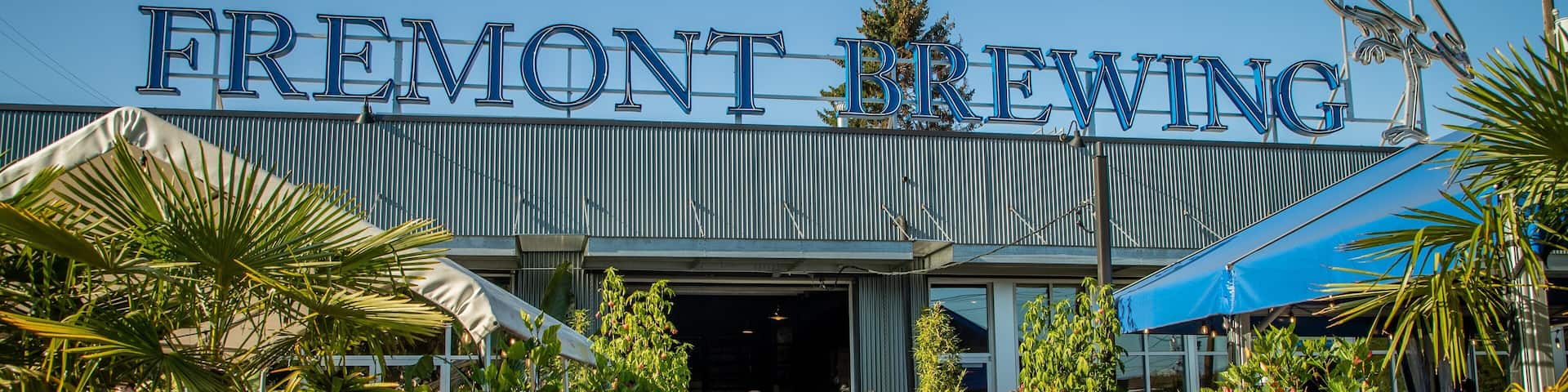 Fremont Brewing which includes flowers and signage as well as a small group of people