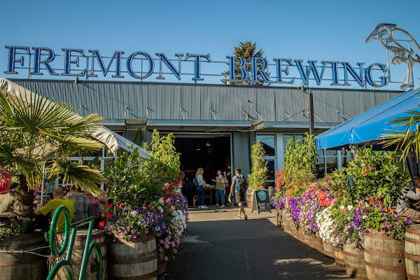 Fremont Brewing which includes flowers and signage as well as a small group of people
