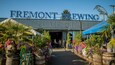 Fremont Brewing which includes flowers and signage as well as a small group of people