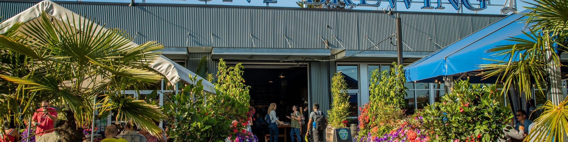 Fremont Brewing which includes flowers and signage as well as a small group of people