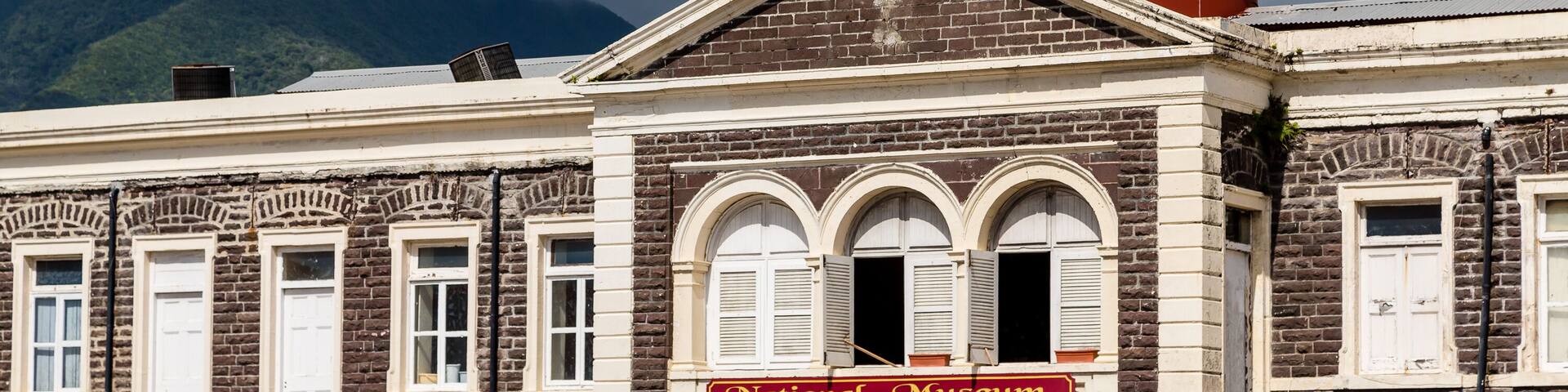 A historic building with a sign reading 'National Museum' and a dome structure.