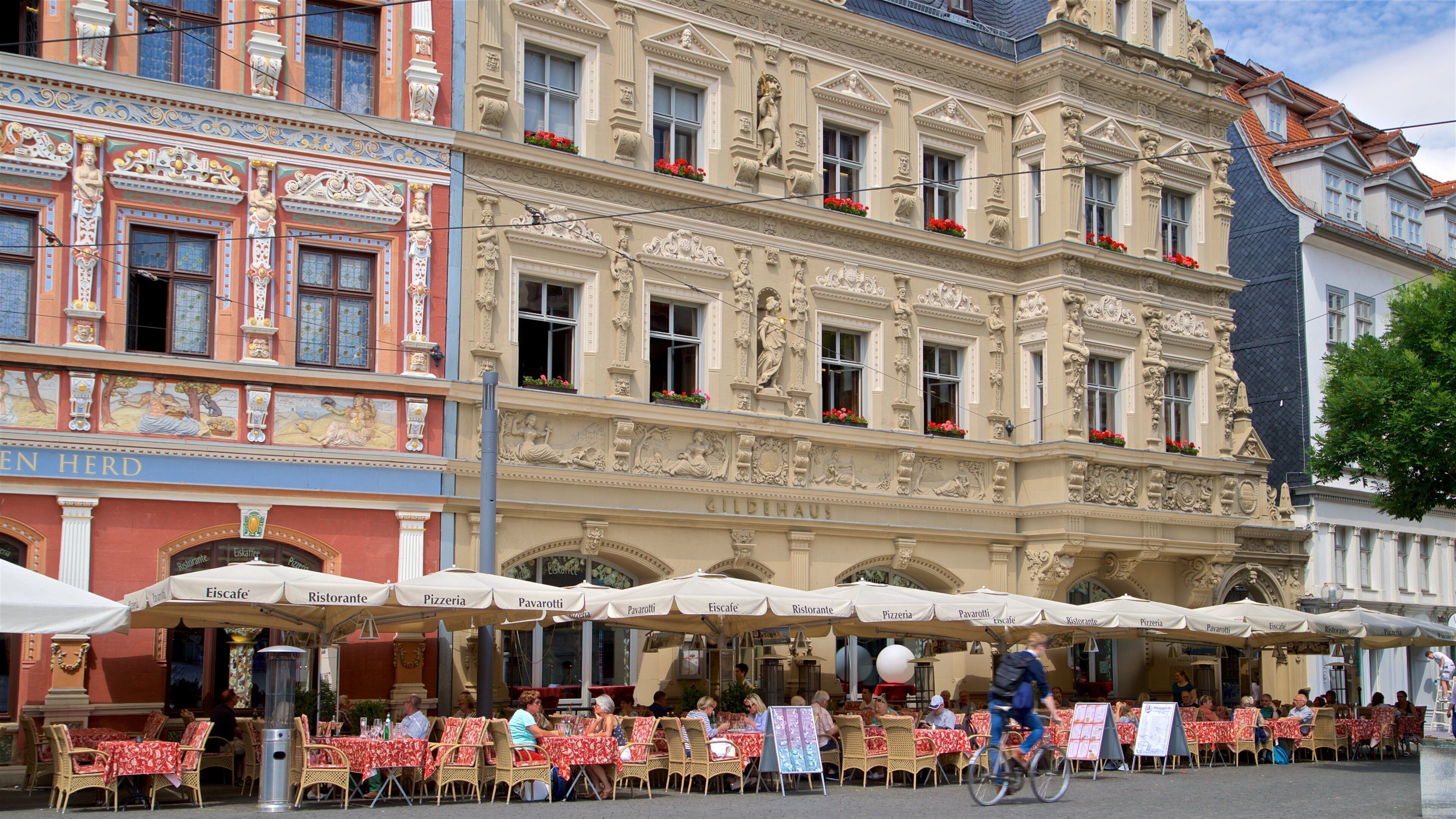 Gildehaus showing outdoor eating and heritage elements as well as a small group of people
