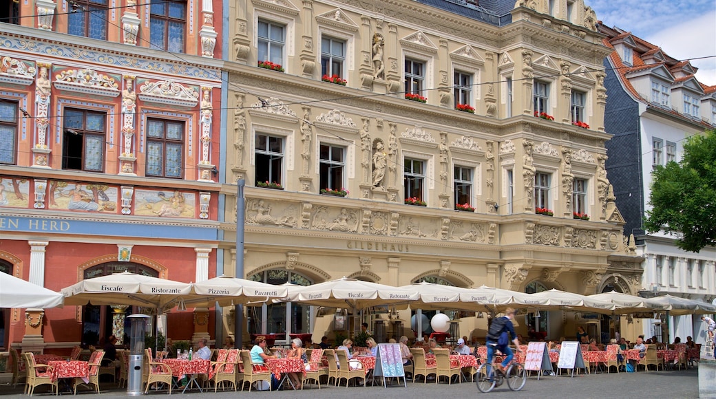 Gildehaus showing outdoor eating and heritage elements as well as a small group of people