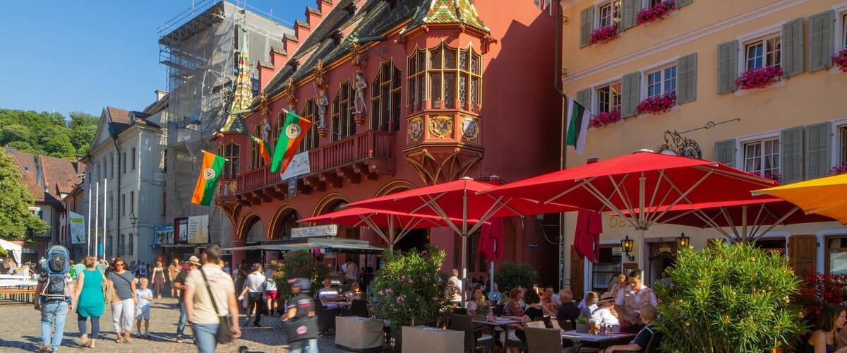 Historical Merchants\' Hall featuring outdoor eating, heritage elements and street scenes