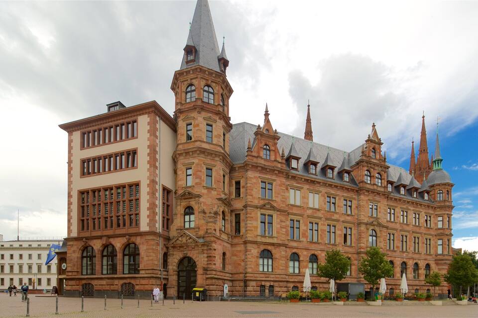 A historic building with multiple spires and arched windows.
