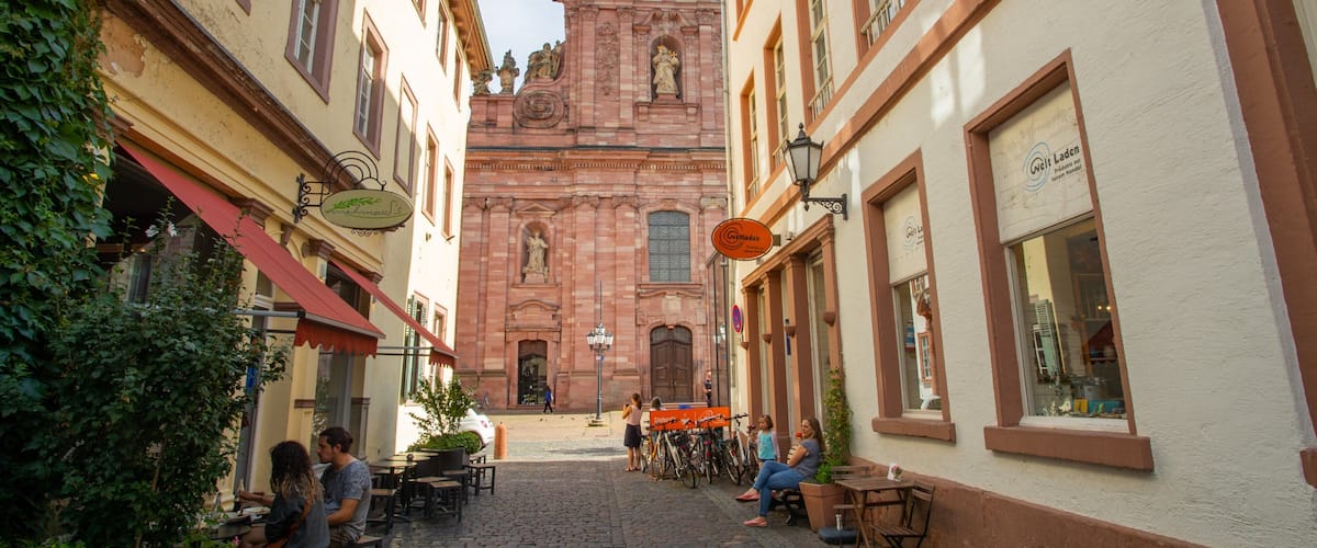 Jesuitenkirche which includes outdoor eating, heritage elements and a church or cathedral