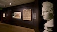 A museum interior with classical art and sculptures.