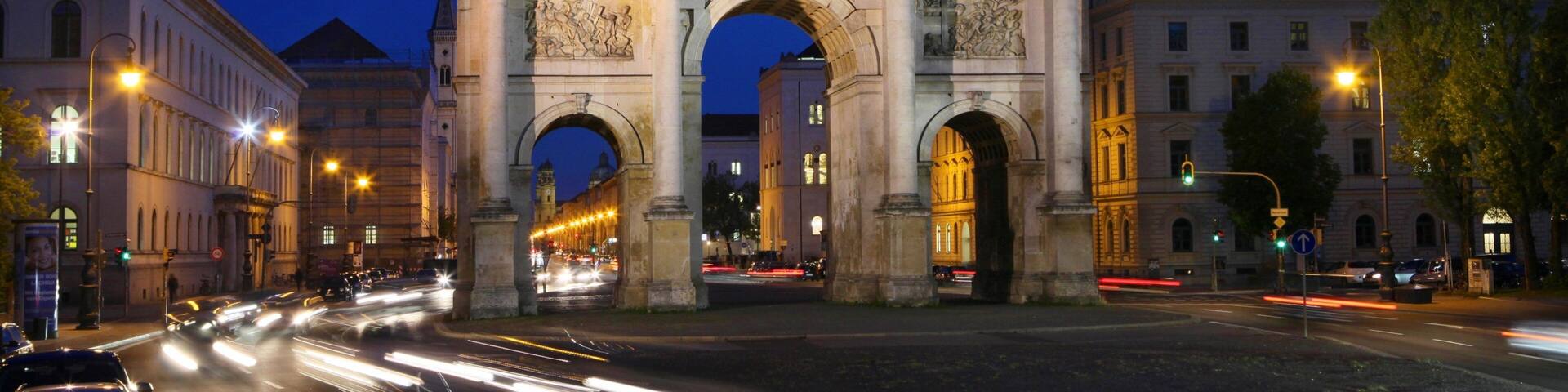 Siegestor showing a city, night scenes and heritage elements