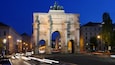 Siegestor showing a city, night scenes and heritage elements
