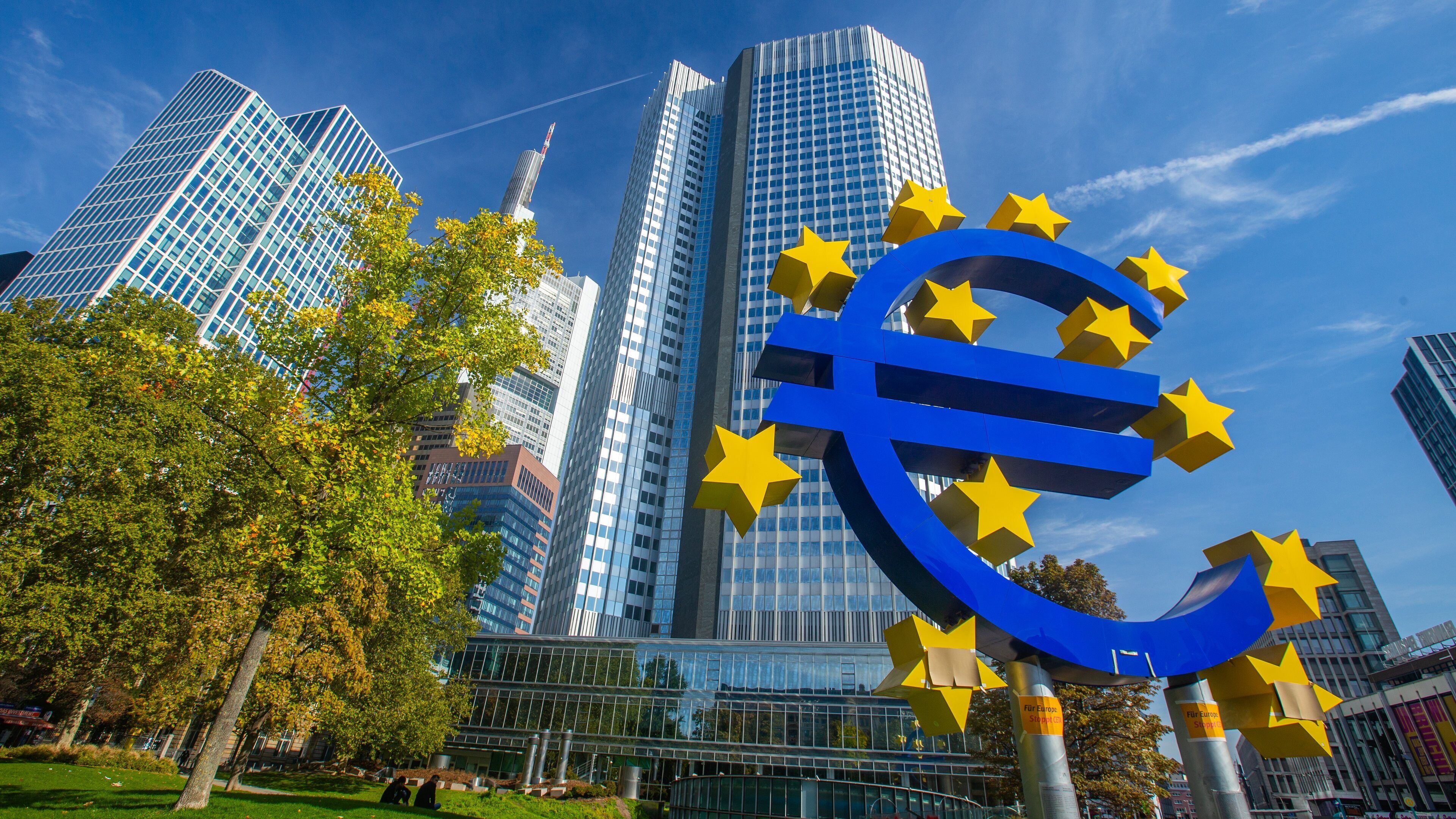 Euro Symbol showing a city, outdoor art and signage