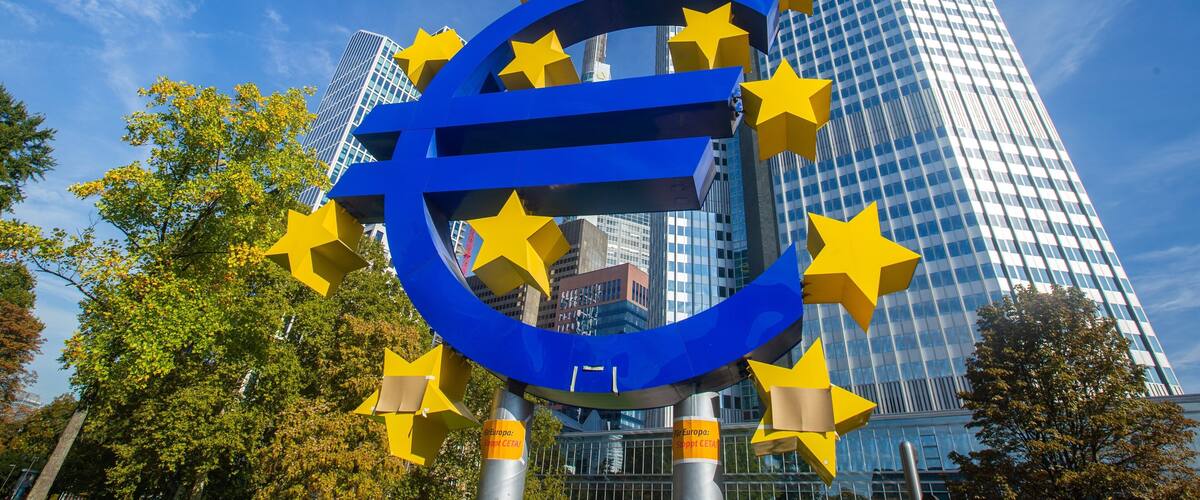 Euro Symbol which includes signage, a city and outdoor art