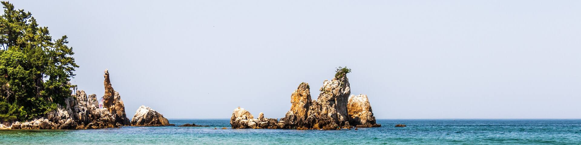 Panorama of Candlestick Rock, korean Chotdaebawi with clips and coastline. Donghae, Gangwon Province, South Korea, Asia.